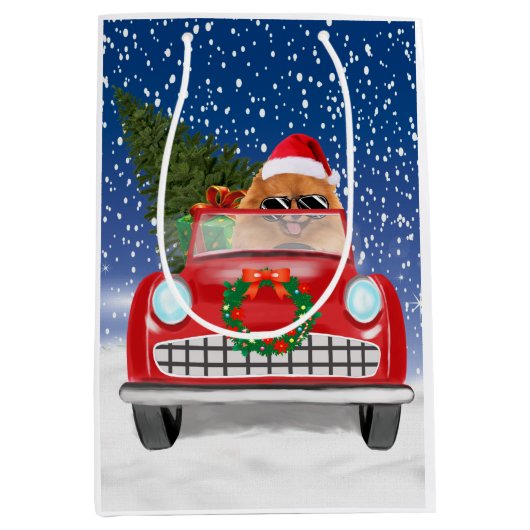 ポメラニア犬の犬が雪のクリスマスに車を運転 ミディアムペーパーバッグ (正面)