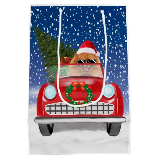 ポメラニア犬の犬が雪のクリスマスに車を運転 ミディアムペーパーバッグ (裏面)