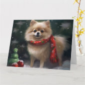 ポメラニア犬の犬が雪のクリスマス カード (黄色い花)