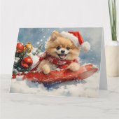 ポメラニア犬犬のソリで雪のクリスマス カード (正面)