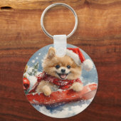 ポメラニア犬犬のソリで雪のクリスマス キーホルダー (裏面)