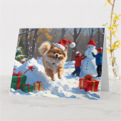 ポメラニア犬走のクリスマス帽子と雪の中 カード (黄色い花)