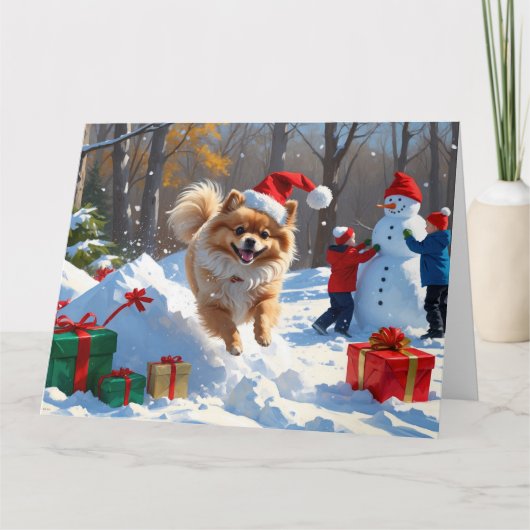 ポメラニア犬走のクリスマス帽子と雪の中 カード (正面)