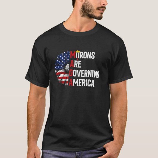 マガモロンがアメリカ合衆国国旗パトリオティを統治している Tシャツ (正面)