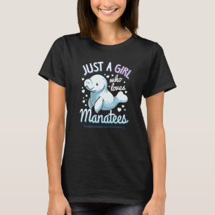 マナティーを愛する女の子が牛のデュコンを見るかわいい Tシャツ