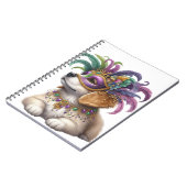 マルディグラの服を着た可愛らしい毛羽立ち犬 ノートブック (左側)