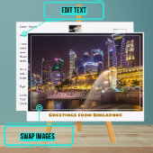 マーライオンをフィーチャーした夜のシンガポールのスカイライン ポストカード