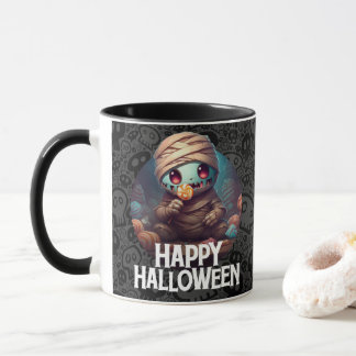ミイラがキャンディを食べる ハッピーハロウィン マグカップ