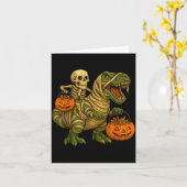 ミイラに乗るスケルトンのティラノサウルス・ハロウィン カード (黄色い花)