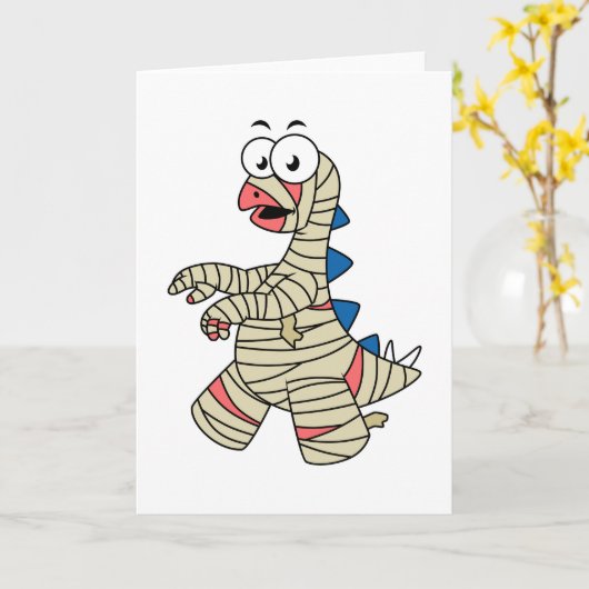 ミイラの格好をした漫画のステゴサウルス。 カード (黄色い花)