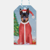ミニチュア・ピンシュの雪にクリスマスのプレゼントを贈る犬 ギフトタグ (裏面)