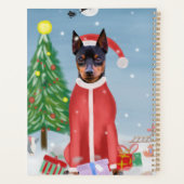 ミニチュア・ピンシュの雪にクリスマスのプレゼントを贈る犬 プランナー手帳 (裏面)