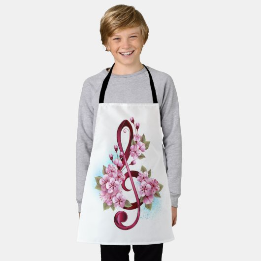 ミュージカル高音クレフ、 音符記号ノートと桜花 エプロン (着用した状態)