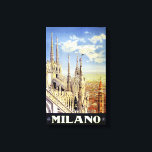 ミラノイタリアヴィンテージ旅行ポスター復元 キャンバスプリント<br><div class="desc">ミラノの街並みを超えて、大聖堂の屋根と尖塔を示す修復されたデジタル強化された旅行ポスター。不完全性の除去。色を修正。画像はLibrary of Congressの提供。</div>