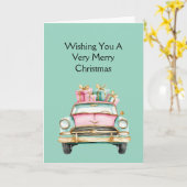 ミントピンクの車のクリスマスギフト カード (黄色い花)