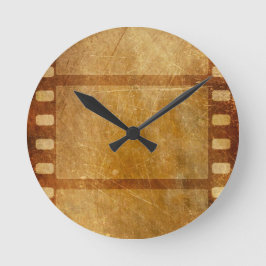 ムービーリール古ファッションド金ゴールドグランジ背景DI ラウンド壁時計