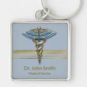 メディカルライトブルーフェイクカドゥセウス金ストライプ箔 キーホルダー (正面)