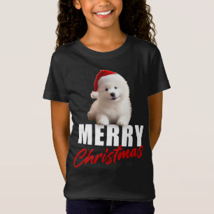 メリークリスマスかわいいサンタ帽子のサモイ子犬 Tシャツ