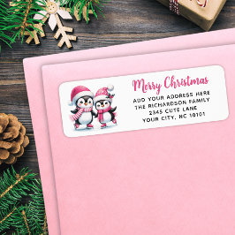 メリークリスマスかわいい氷のスケートで滑るペンギンピンク ラベル