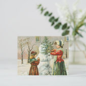 メリークリスマスの女性、子供と雪だるまの休日 シーズンポストカード (スタンド正面)
