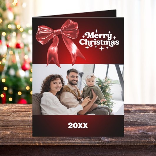メリークリスマスの赤い弓の写真カード年レビュー シーズンカード