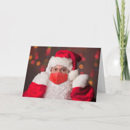メリークリスマスサンタクロース顔マスクを被る シーズンカード