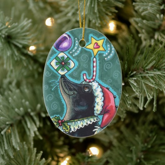 メリークリスマスシールの贈り物と菓子の杖を釣り合わせる。 セラミックオーナメント (ツリー)