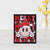 メリークリスマススマイル顔サンタクロースハットグルーヴィ カード (黄色い花)