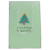 メリークリスマスドッグアイススケートで滑るピスタチオグリーン ミディアムペーパーバッグ (裏面)