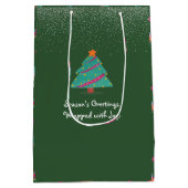 メリークリスマスドッグアイススケートで滑るフェスティバルグリーン ミディアムペーパーバッグ (裏面)