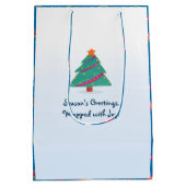 メリークリスマスドッグアイススケートで滑る名ブルー ミディアムペーパーバッグ (裏面)