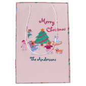 メリークリスマスドッグアイススケートで滑る赤面ピンク ミディアムペーパーバッグ (正面)