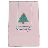 メリークリスマスドッグアイススケートで滑る赤面ピンク ミディアムペーパーバッグ (裏面)