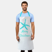メリークリスマスパステルティール(緑がかった色)ブルースターフィッシュホワイト エプロン (着用した状態)