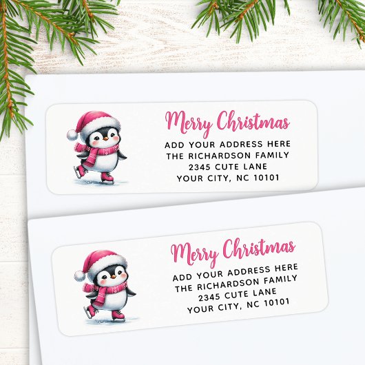 メリークリスマスピンクかわいい氷スケートで滑るペンギン ラベル