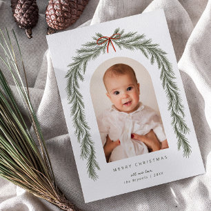 メリークリスマスボウと植物性の松のアーチ写真 シーズンカード