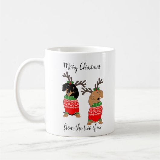 メリークリスマス2人がダックスフントを飾った コーヒーマグカップ (左)