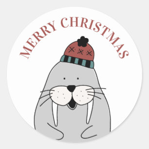 メリークリスマス.かわいい冬のセイウチ。おもしろい動物 ラウンドシール