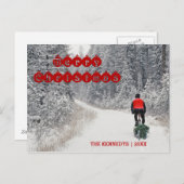 メリークリスマス – バイクもしくは自転車に乗る人が木を持ち帰る シーズンポストカード (正面/裏面)