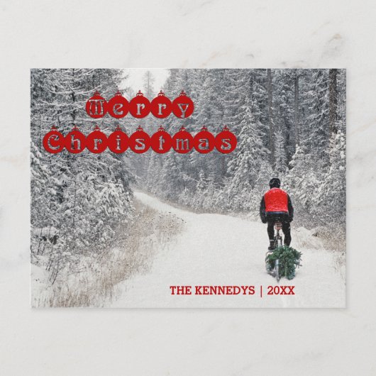 メリークリスマス – バイクもしくは自転車に乗る人が木を持ち帰る シーズンポストカード (正面)