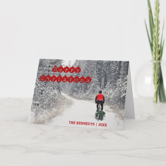 メリークリスマス-木を家に持って来ているバイクもしくは自転車に乗る人 シーズンカード (正面)