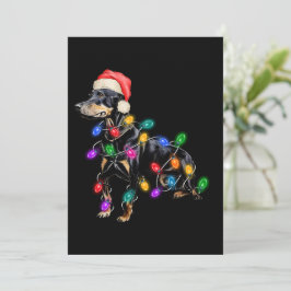 メリークリスマス 犬がクリスマスイルミネーションに絡まる シーズンカード