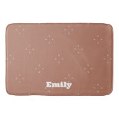 モカのムースの背景にモノグラムの白い矢印 | バスマット (正面)