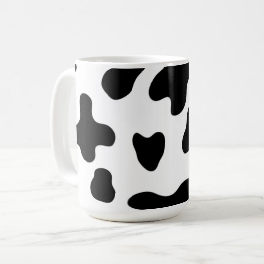 モダンでおしゃれな黒と白の牛 コーヒーマグカップ (正面左)