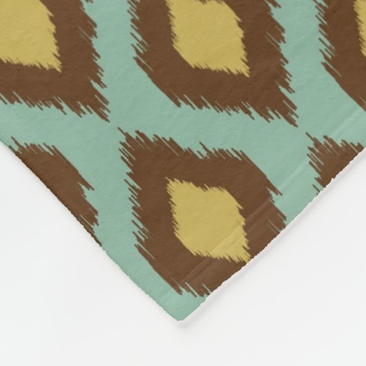 モダンな種族のイカットの青く黄色いモダン フリースブランケット (角)