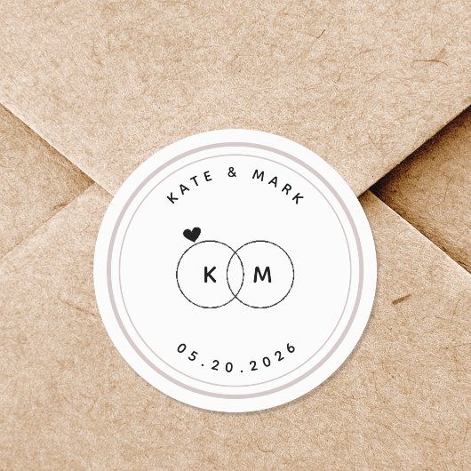 モダンな結婚指輪のイニシャルが入ったSave the Date ラウンドシール