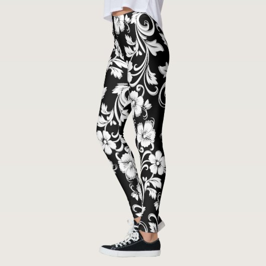 モダンな黒と白の花の透かし彫りアート レギンス (左)