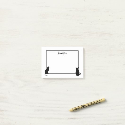 モダンな黒猫は白い名前入りのシルエットを描きます ポストイット (デスク上)