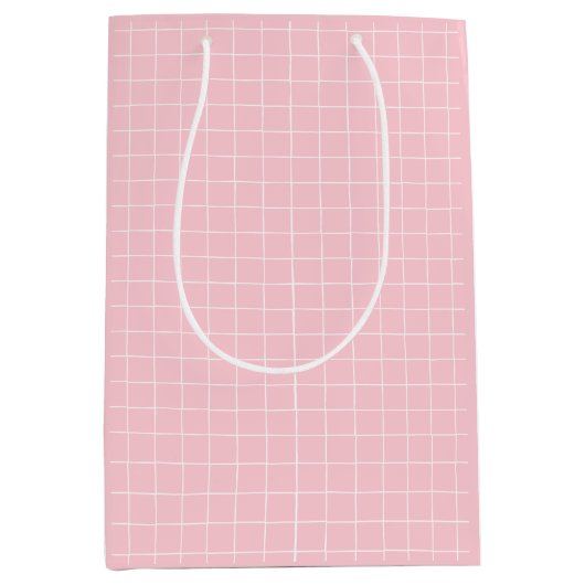 モダンピンクのグリ市松模様にッドパターン ミディアムペーパーバッグ (正面)