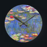 モネスイリ ラウンド壁時計<br><div class="desc">クロード・モネの油絵水彩（1916年）を飾った時計。穏やかな池に浮かぶ美しいピンク、紫、赤の睡蓮。印象派素晴らしや芸術のファンのためのフランスの贈り物。</div>